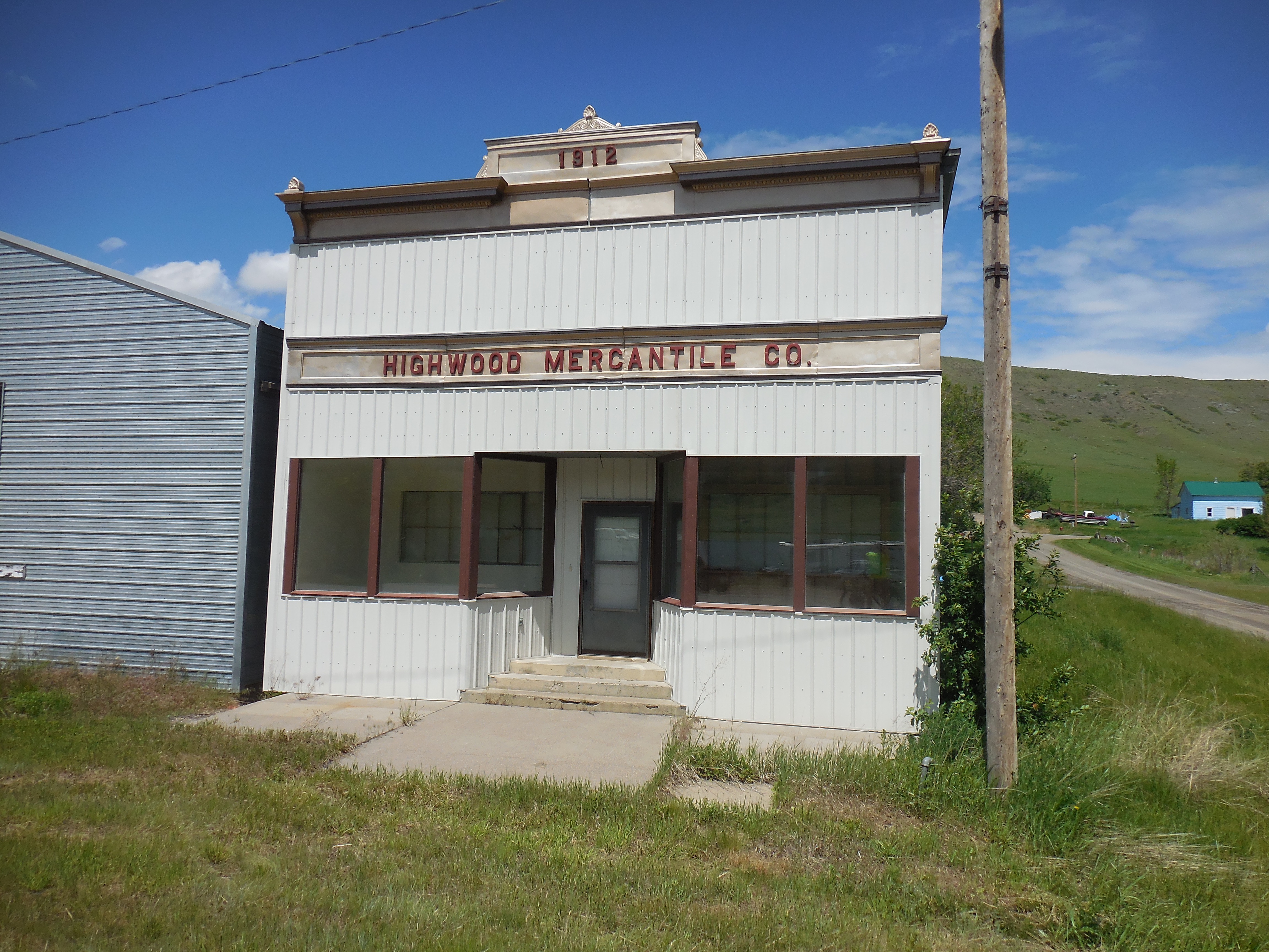 Sign of the times of rural America.  Another vacant building in HIghwood, MT.
